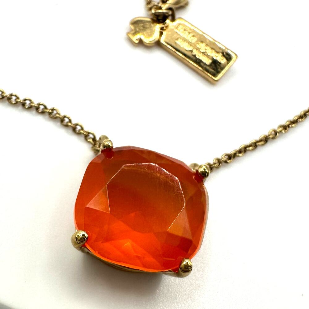 Kate Spade Cause a Stir gold plated opaque orange rhinestone pendant necklace